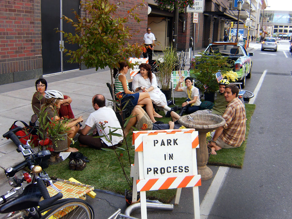 Park-ing Day Make-shift outdoor seating with temporary landscaping in the streets.